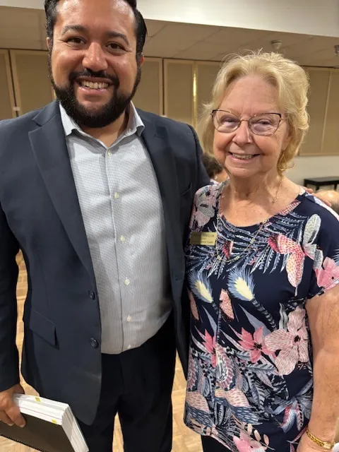 Two smiling guests at a Guild event.